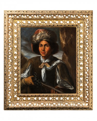 Portrait d’un jeune homme avec béret de style polonais et fusil