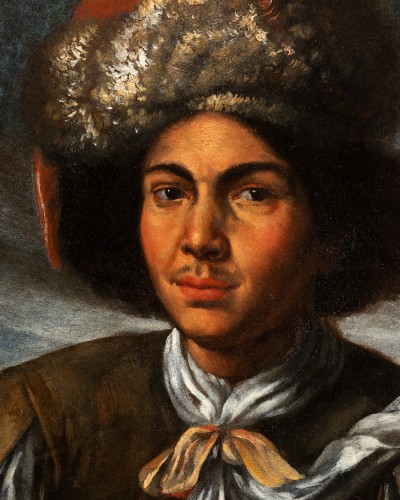 Portrait of a young man with polish-style beret and rifle - 