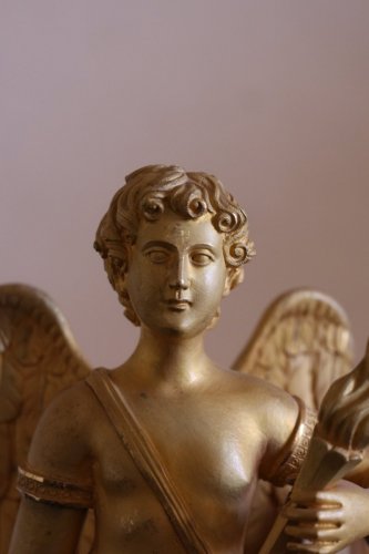 Antiquités - Pendule en bronze doré animée d'un ange, époque Empire, début du XIXe siècle