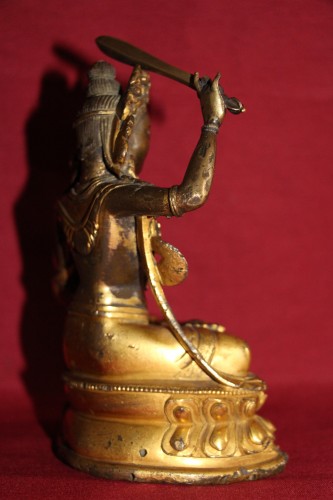 Antiquités - Buddha of wisdom with sword Manjushri out of gilded bronze, Tibet, at the end of XVIIe.