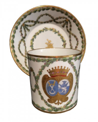 Sèvres hard-paste cup and its saucer, with armorial decoration, 1776