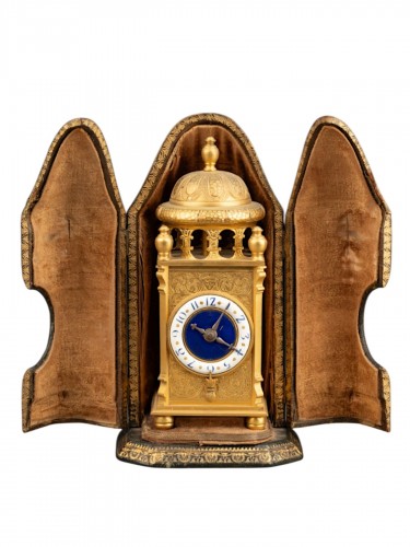 19th-century gilt bronze table clock with a blue and white enamel dial