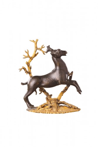 A Small Bronze Group of a Prancing Stag 