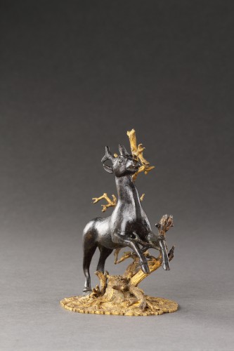 Decorative Objects  - A Small Bronze Group of a Prancing Stag 