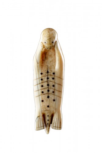 A Fine Large and Rare Inuit Amulet of a Seal Laying on His Back 