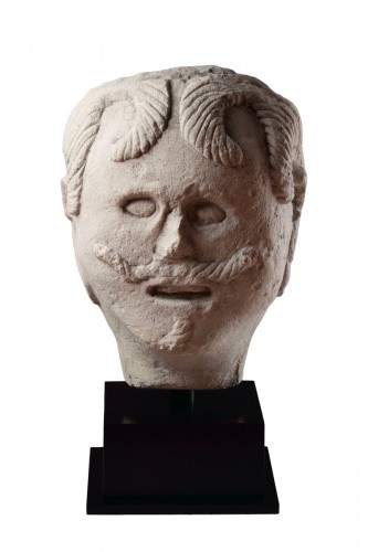 A Large European Carved Limestone Celtic Votive Head of a Male
