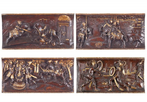 A Set of Four Tuscan Carved Wood and Parcel Gilt Equestrian Reliefs