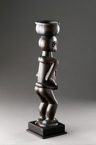  - A Large Finely Carved ‘Cup Carrier’ of a Women with Child 