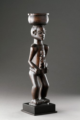 Antiquités - A Large Finely Carved ‘Cup Carrier’ of a Women with Child 