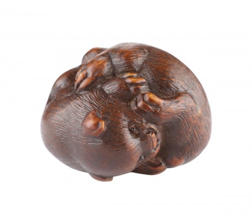 A Finely Carved Wood Netsuke of Two Puppy Dogs Playing 