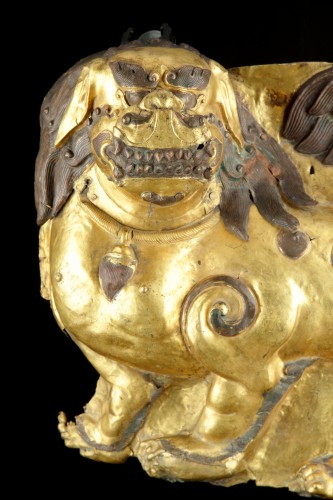 Asian Works of Art  - Tibetan Gilt Copper Repoussé Panel Depicting a Standing Snow Lion
