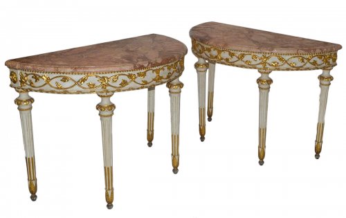 Pair of Italian, Neoclassical, painted and parcel-gilt demi-lune consoles