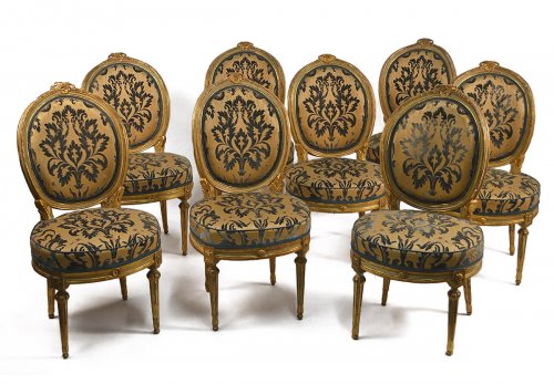 Set of eight, Northern Italian, painted and parcel-gilded dining chairs