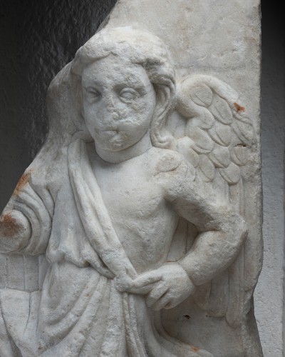 BC to 10th century - Fragment of a marble relief depicting a winged genius, 2nd–3rd century