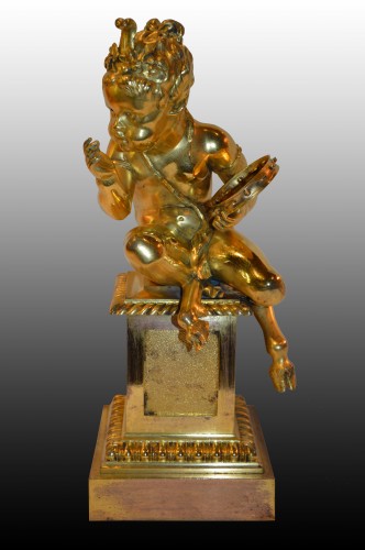 Objet de décoration  - Feu en bronze doré "aux jeunes Satyres"