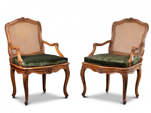 Pair of "à la reine" caned fauteuils by Jean Avisse