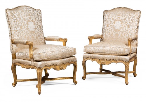 Pair of French Régence period giltwood armchairs