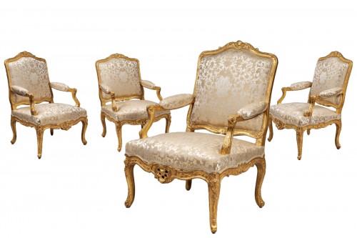 Four carved and gilded armchairs, Ile de France circa 1720