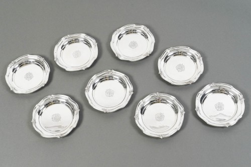 Henin - Suite de huit dessous de bouteilles en argent massif - 