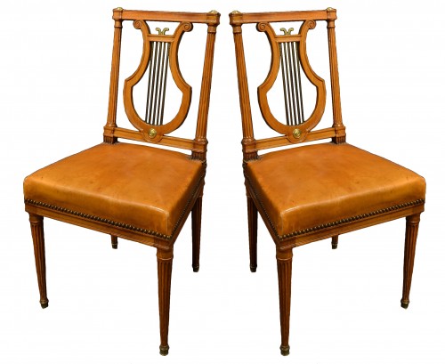 A set of nine Louis XVI mahogany chairs