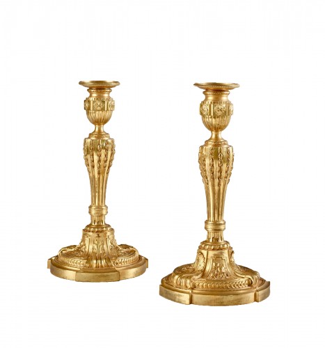 A fine pair of Louis XVI ormolu candlesticks