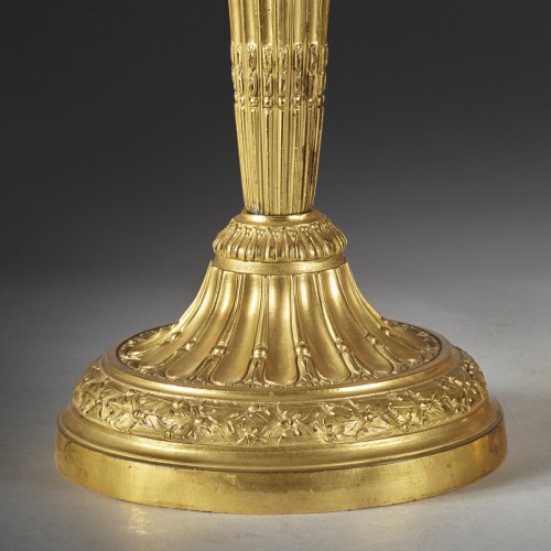 Lighting  - A Pair of candle holder with roughened flutes and oak leaves frieze