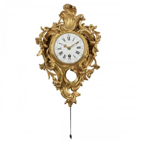 An alcove cartel clock in chased and gilt bronze