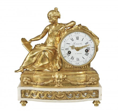A mantel clock representing a figure of Prudence