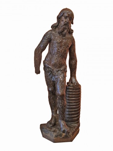 Wood sculpture representing a wild man