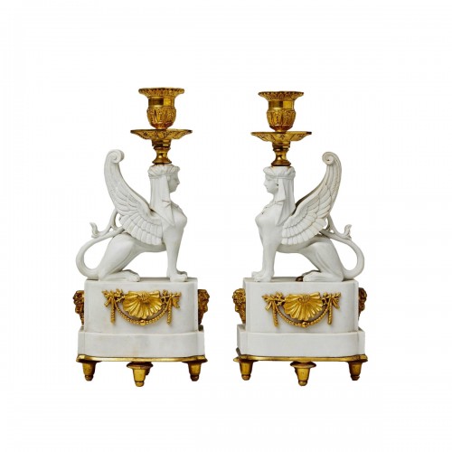 A Pair of Bicuit  andGilt Bronze Sphynxes Candelsticks 