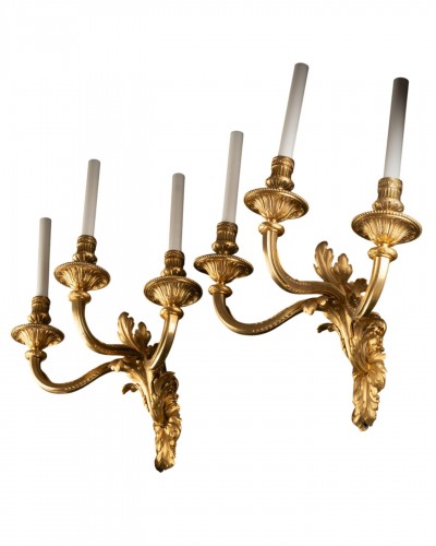 Set Of Four “Transition” Gilt Bronze Three-light Wall-lights