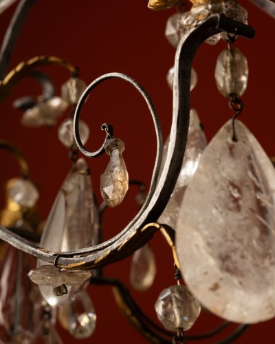 Lighting  - A Six-light chandelier in hammered iron and gilt bronze