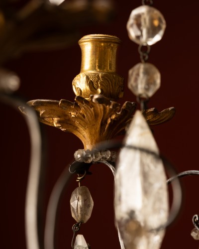  - A Six-light chandelier in hammered iron and gilt bronze