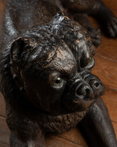Sculpture  - A Painted Reclining terracotta pug With Sulphide Eyes