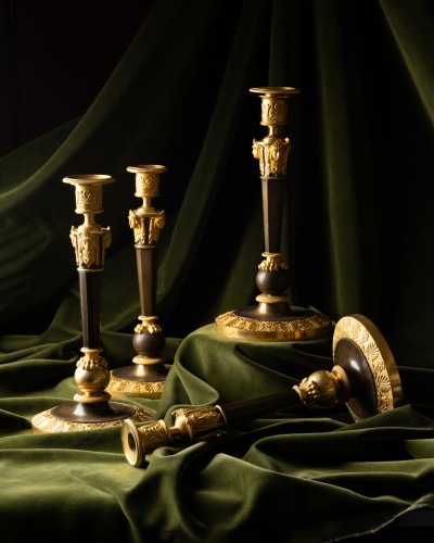 Lighting  - A Set of Four Empire Parcel-Gilt “Claw-Foot” Candlesticks with Antique Mask