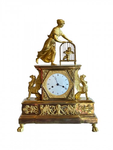 L'Amour en cage, pendule en bronze doré d'époque Empire