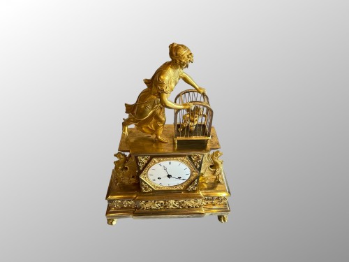 L'Amour en cage, pendule en bronze doré d'époque Empire - Horlogerie Style Empire