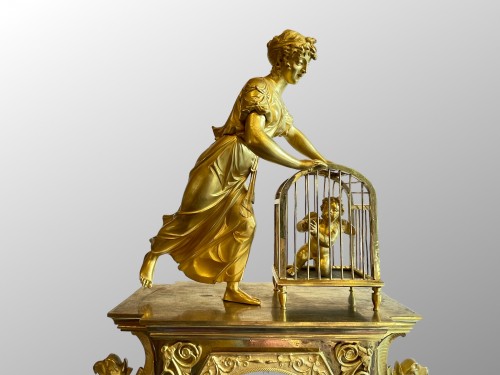 L'Amour en cage, pendule en bronze doré d'époque Empire - Galerie Maxime Fustier