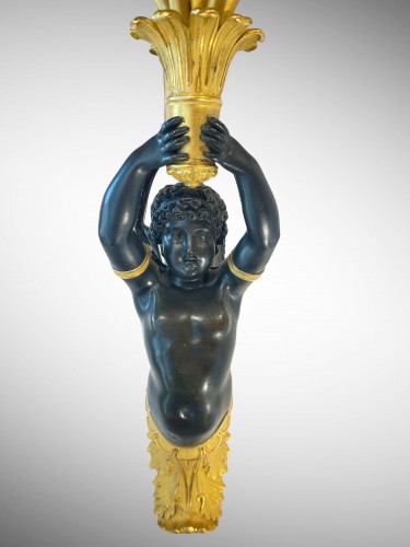 19th century - Pair of large Empire-period ormolu and patinated sconces