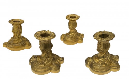 Set of Four bronze candlesticks of the late 19th century
