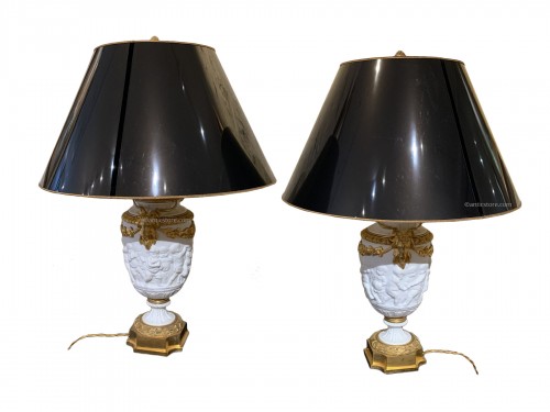 Pair of late 19th century biscuit vases mounted as lamp