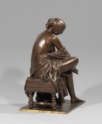 Sculpture  - Woman putting on her stocking 