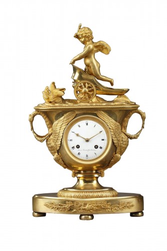 Empire mantel clock with putto on a chariot