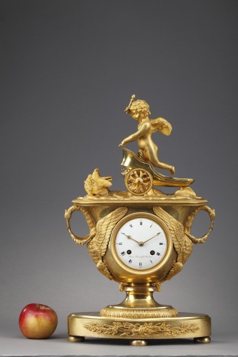 Horology  - Empire mantel clock with putto on a chariot