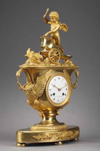 Pendule d'époque Empire avec putto dans un char - Ouaiss Antiquités