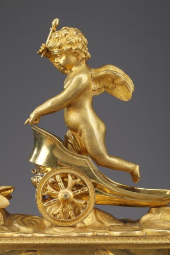 Antiquités - Empire mantel clock with putto on a chariot