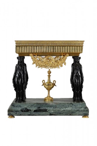 A Late 19th century centerpiece  with Empire style caryatids