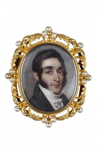 A miniature portrait of a man in a gold frame from the 1st half of the 19th