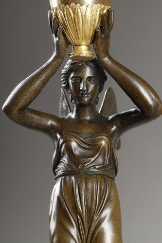 Antiquités - A pair of large candelabra featuring winged female figures, early 19th cent