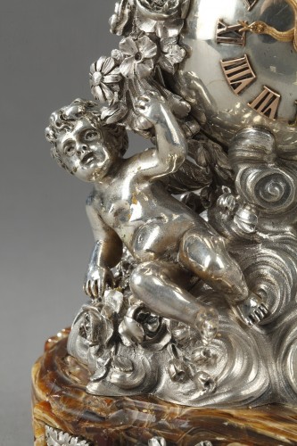 Antiquités - Pendule en argent et onyx dans son étui de cuir